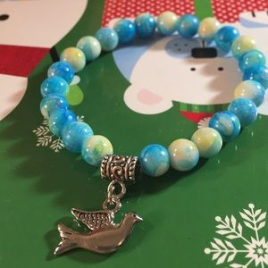 Beautiful glass Beads bracelet with Dove Charm.